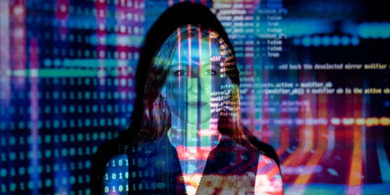 code projected over woman