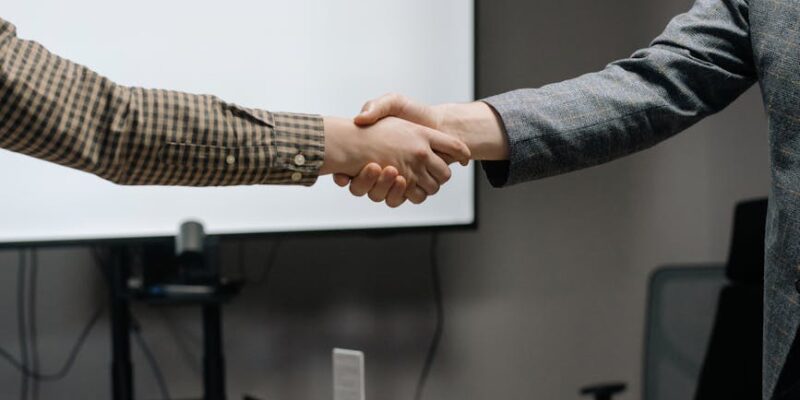people sealing a deal